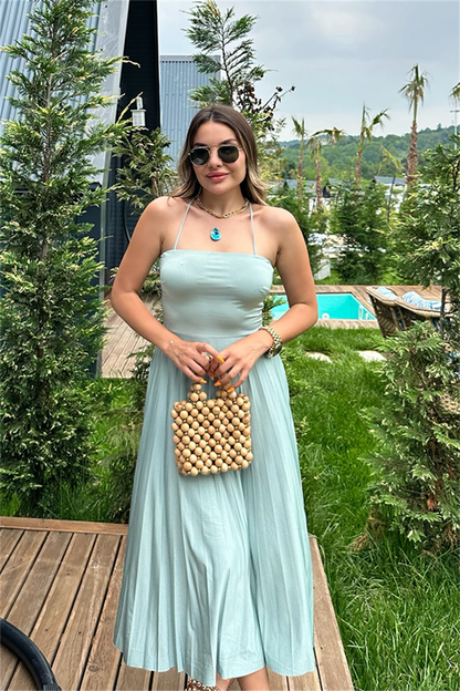 Sırt çapraz dekolteli su yeşili piliseli elbise